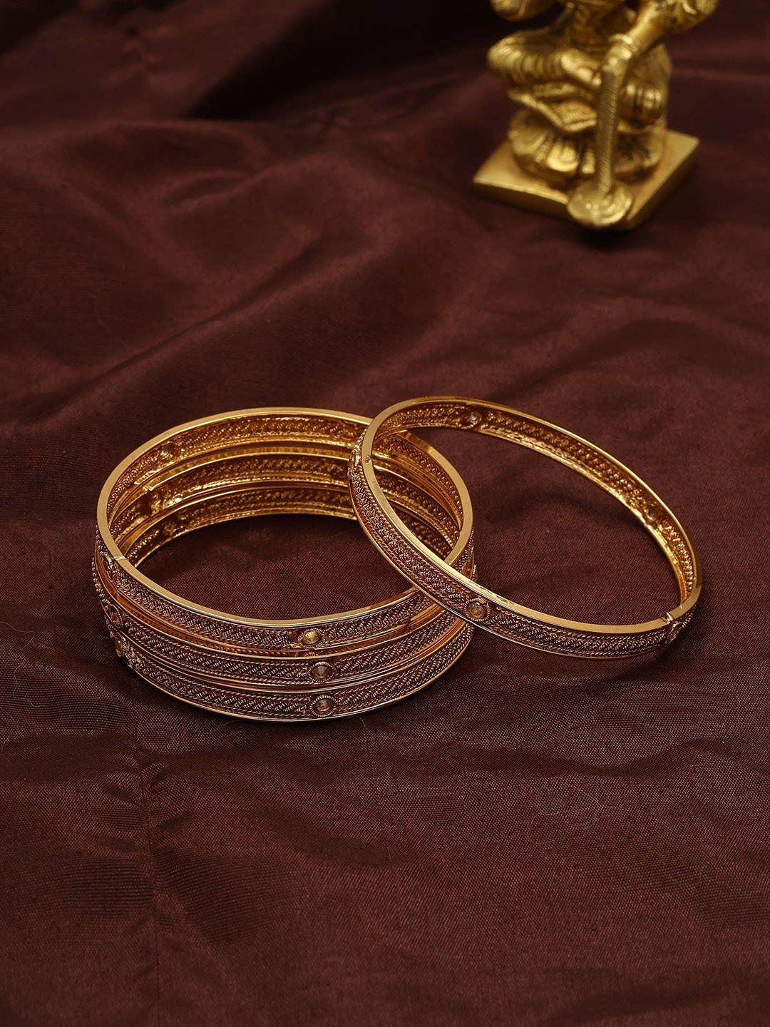 

Exotic India Set Of 4 Gold-Plated Stone Studded Copper Bangles In Copper
