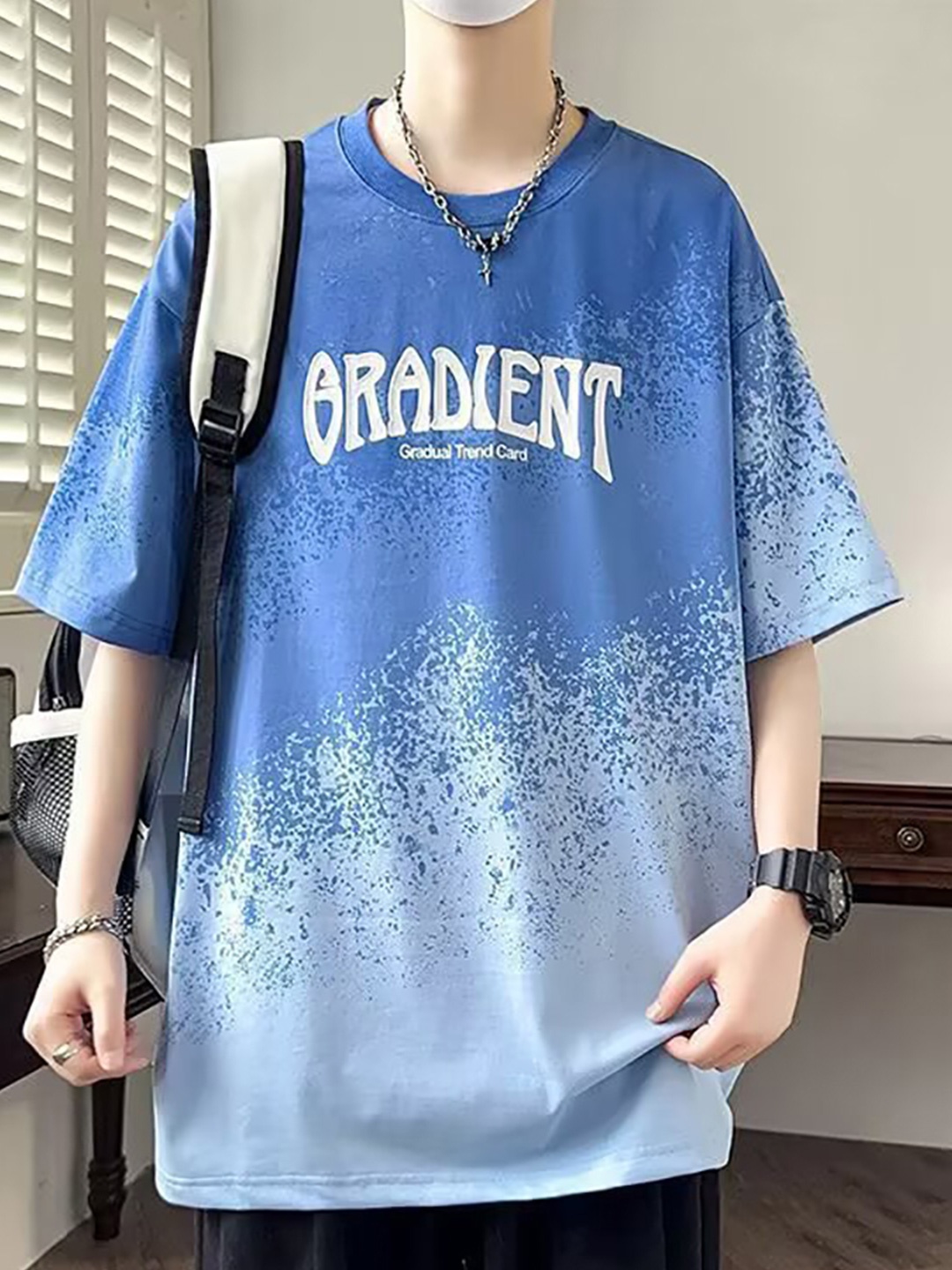 

StyleCast x Revolte Men Abstract Printed Round Neck Oversized T-shirt, Blue