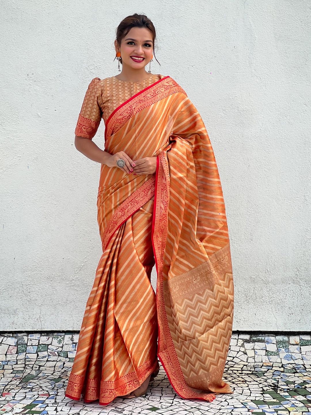 

Rangtulika Ethnics Woven Design Leheriya Saree, Orange