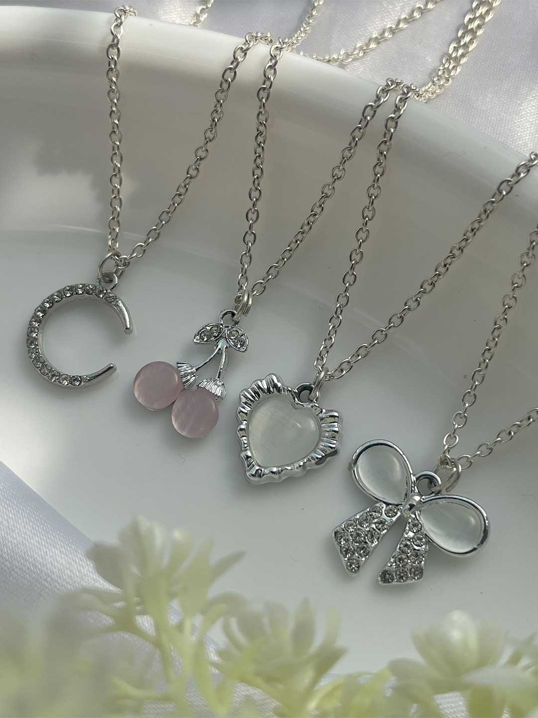 

Jewelsbysirani Set Of 4 Silver-Plated American Diamond Studded Pendants With Chains