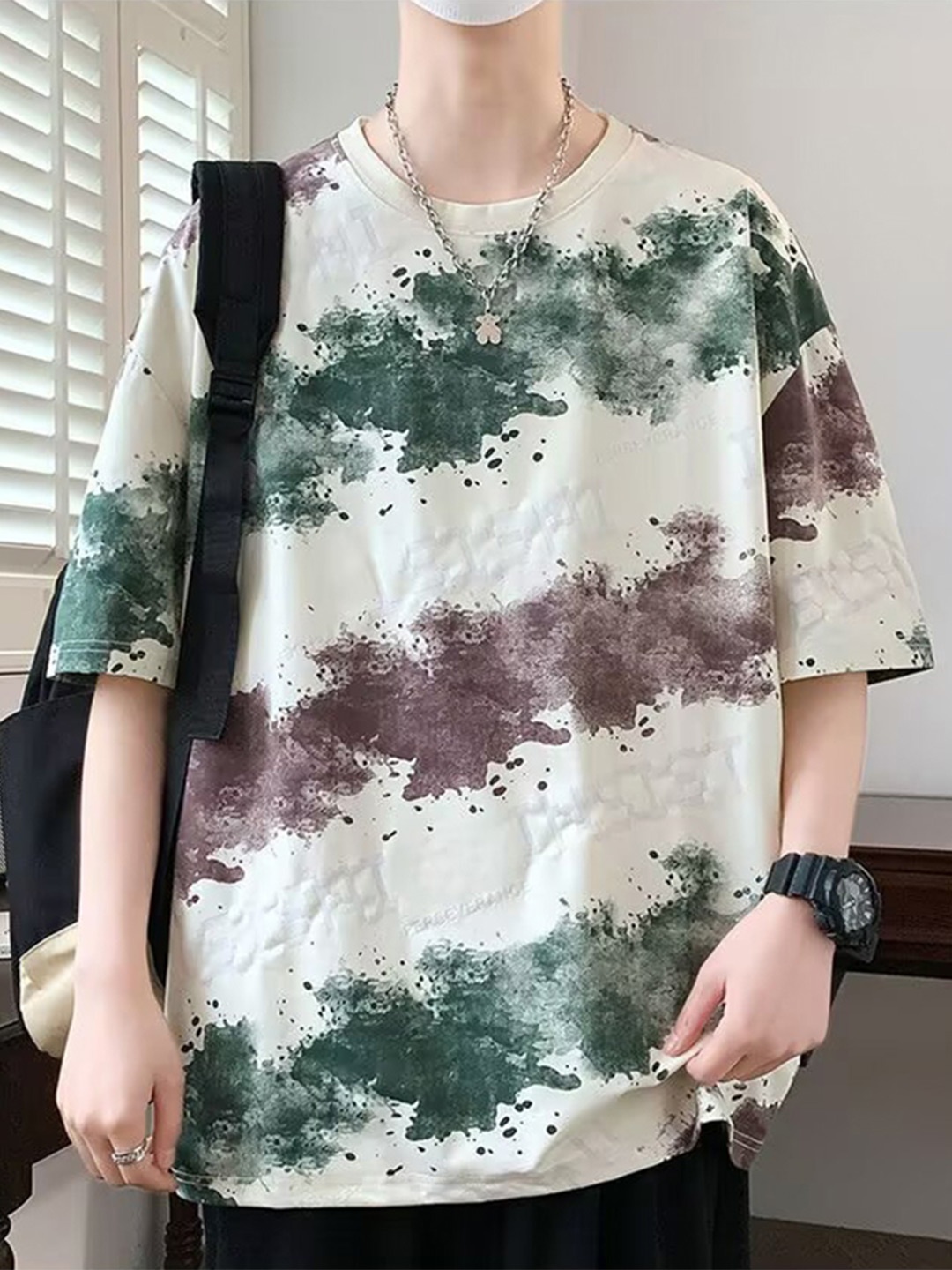 

StyleCast x Revolte Men Abstract Printed Round Neck Oversized T-shirt, White