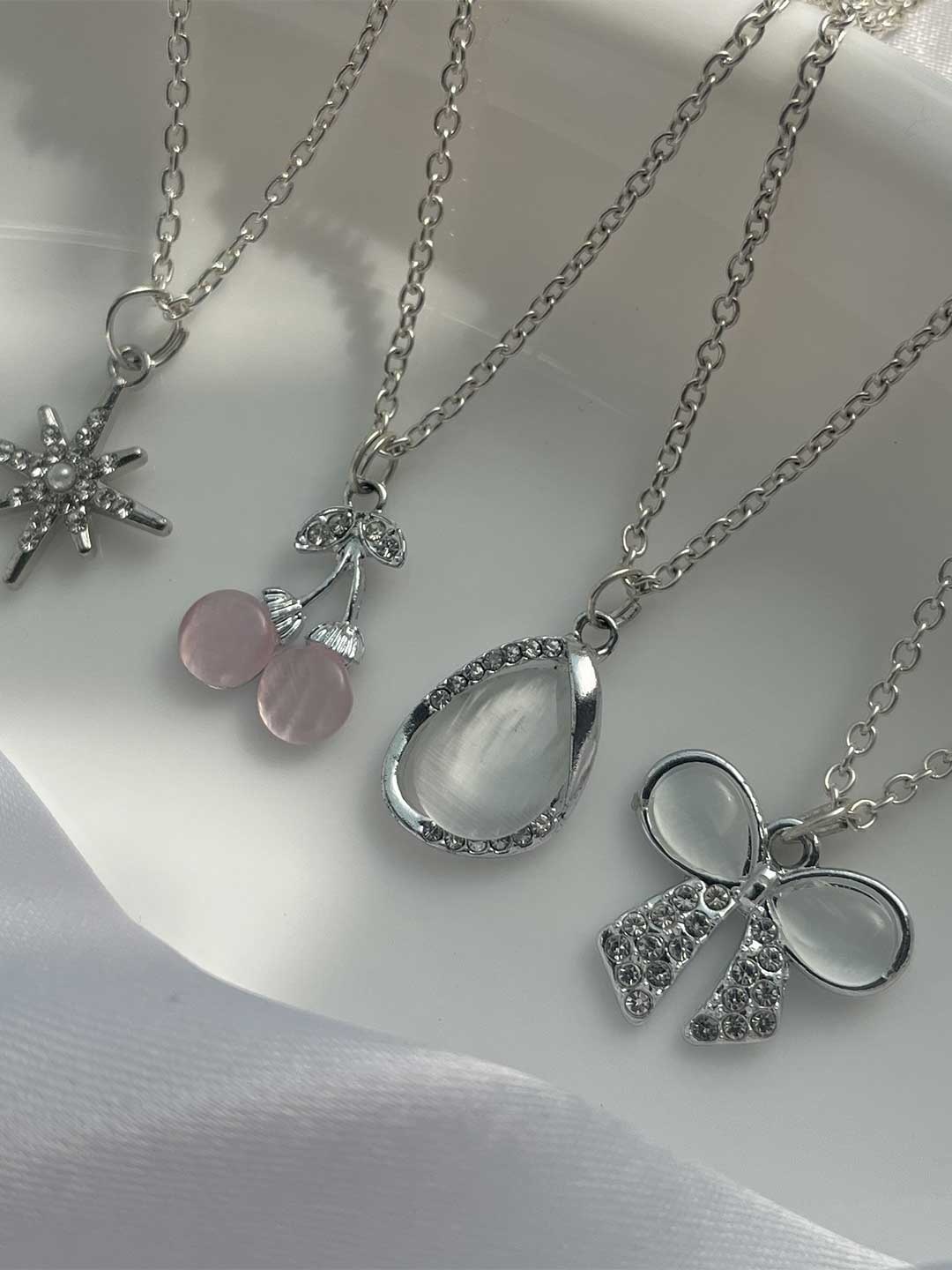 

Jewelsbysirani Set Of 4 Silver-Plated American Diamond Studded Pendants With Chains