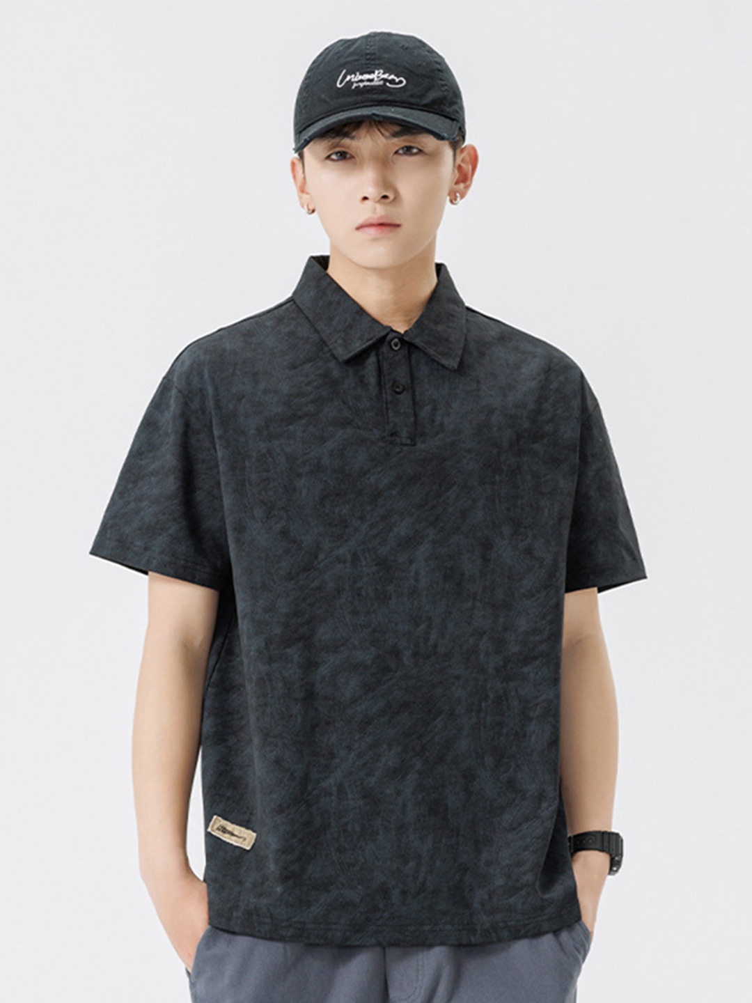 

StyleCast x Revolte Men Abstract Printed Polo Collar Cotton Relaxed Fit T-shirt, Black
