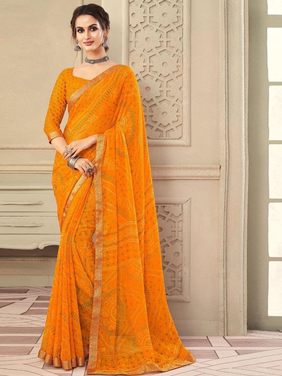 

Styleveda Printed Zari Pure Georgette Bandhani Saree, Yellow