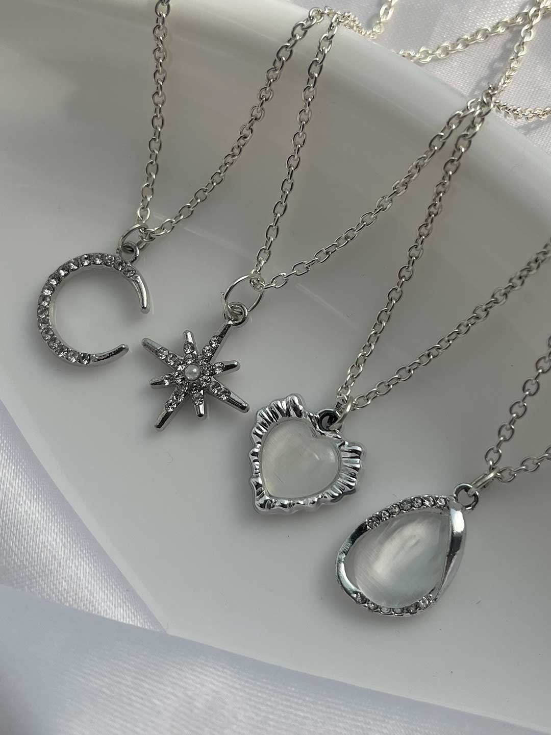 

Jewelsbysirani Set Of 4 Silver-Plated American Diamond Studded Pendants With Chains