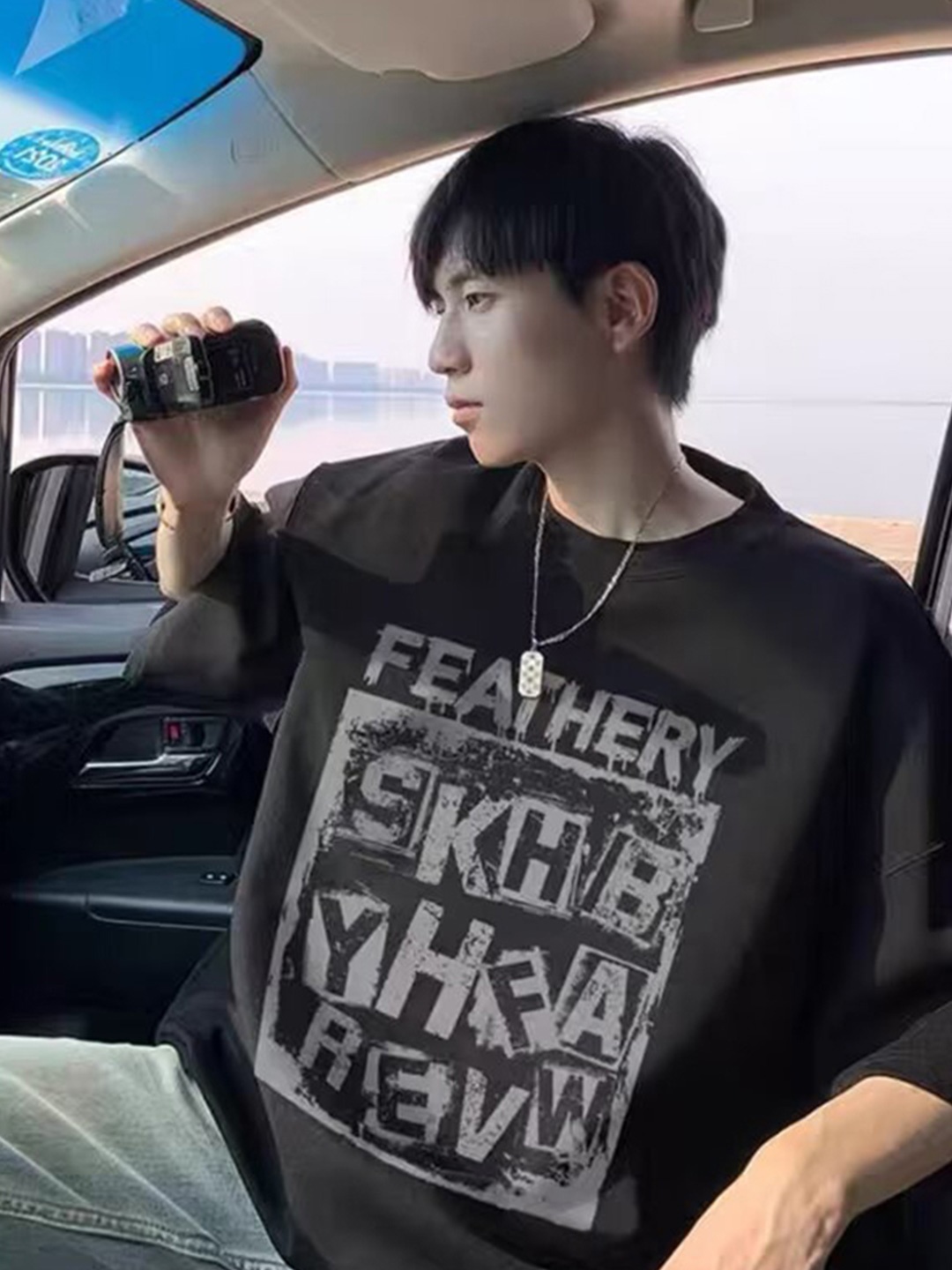 

StyleCast x Revolte Men Typography Printed Round Neck Cotton Oversized T-shirt, Black