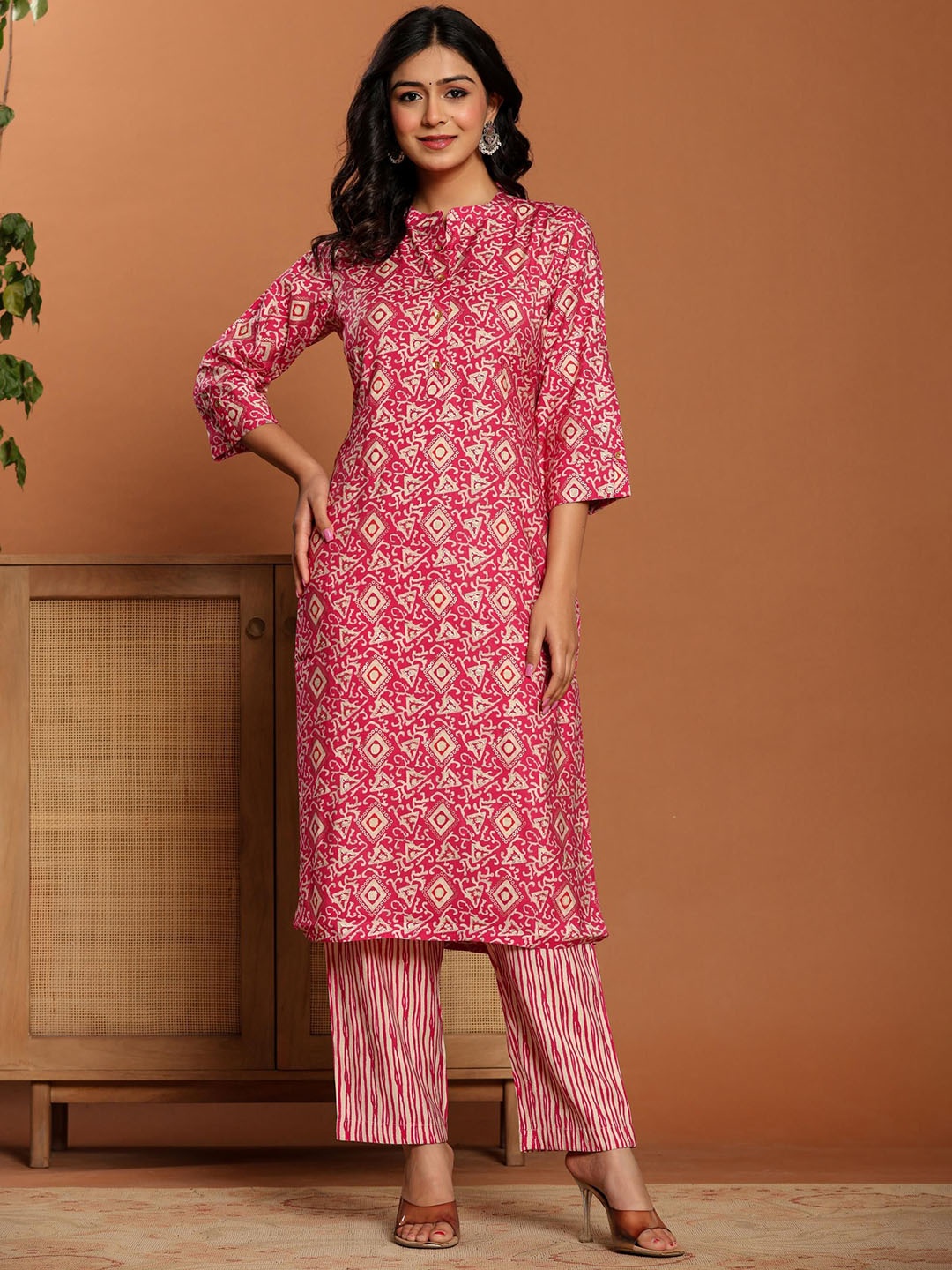 

Ragavi Women Printed Regular Kurta with Trousers, Pink