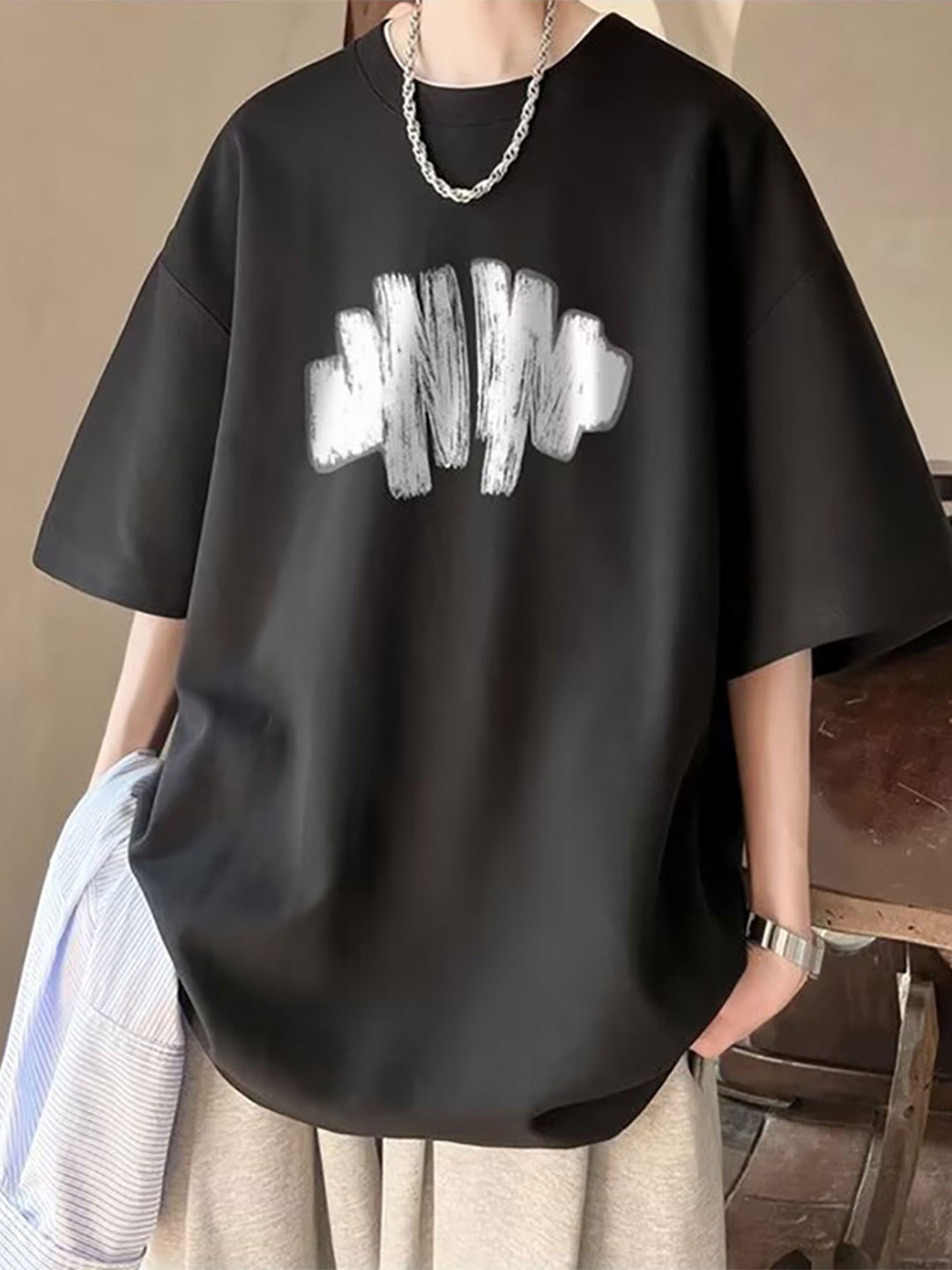 

StyleCast x Revolte Men Graphic Printed Round Neck Cotton Oversized T-shirt, Black