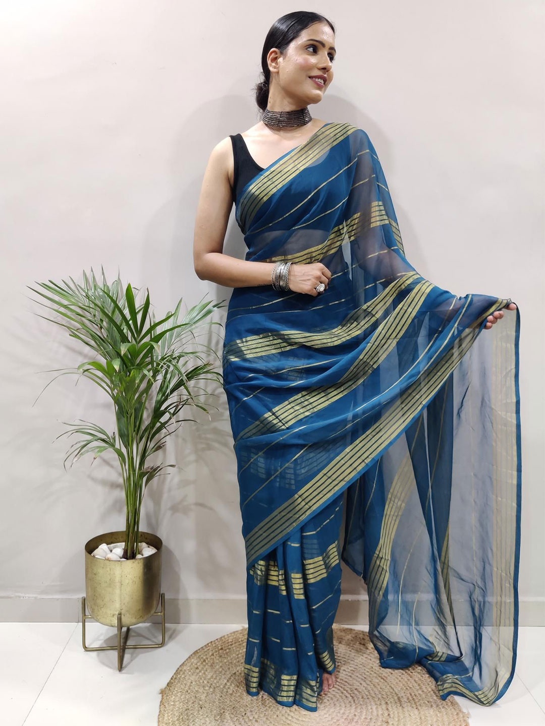 

Moda Rapido Striped Pure Georgette Saree, Teal