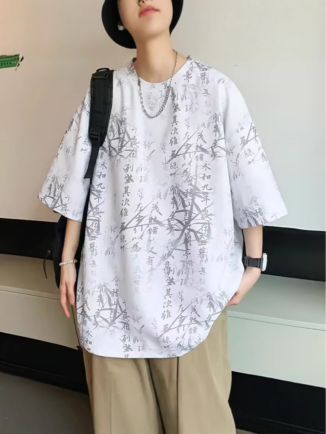 

StyleCast x Revolte Men Abstract Printed Round Neck Oversized T-shirt, White