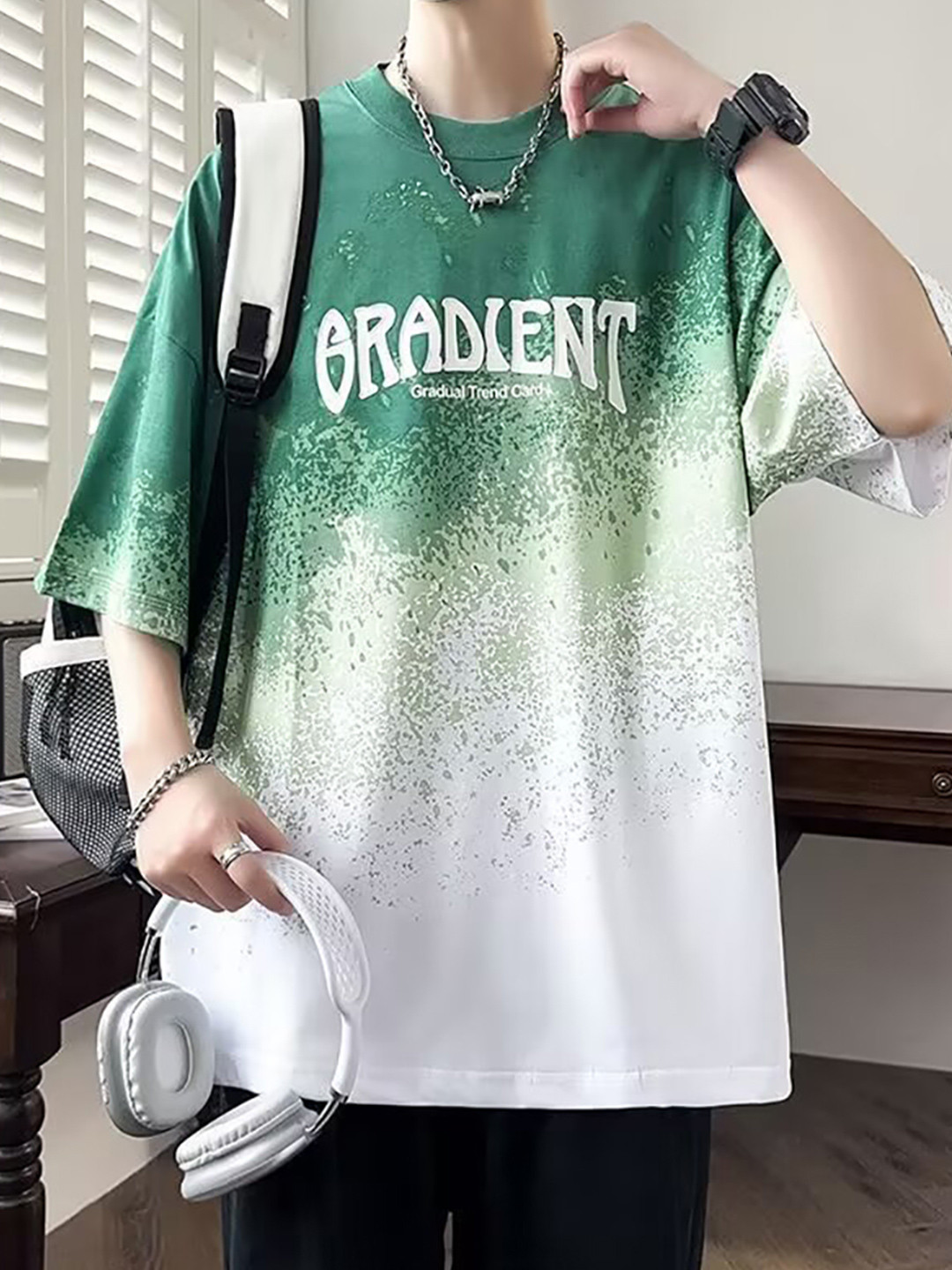 

StyleCast x Revolte Men Abstract Printed Round Neck Oversized T-shirt, Green