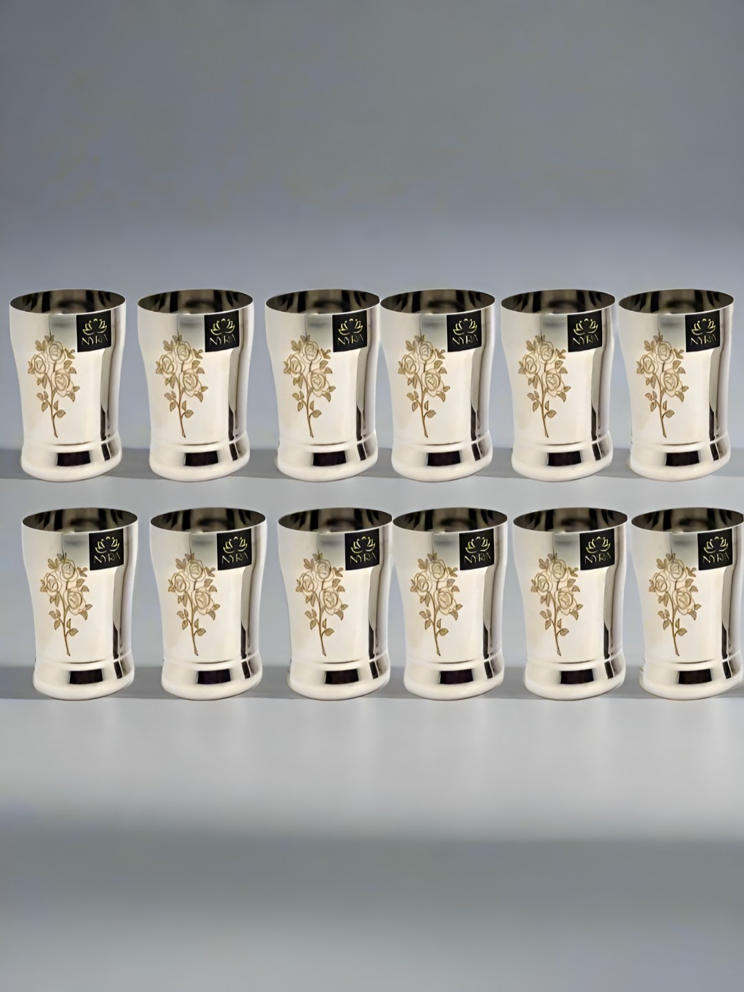 

Nyra Kitchenware Silver-Toned 12 Pieces Floral Stainless Steel Water Glasses-400 ml Each