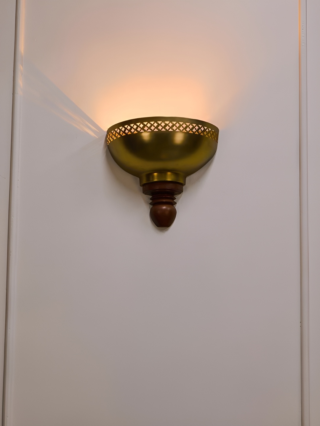 

Fabindia Gold-Toned & Brown Textured Metal Wall Lamp
