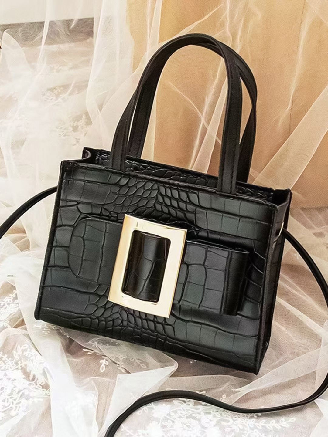 

HAUTE SAUCE by Campus Sutra Textured PU Structured Sling Bag with Tasselled, Black
