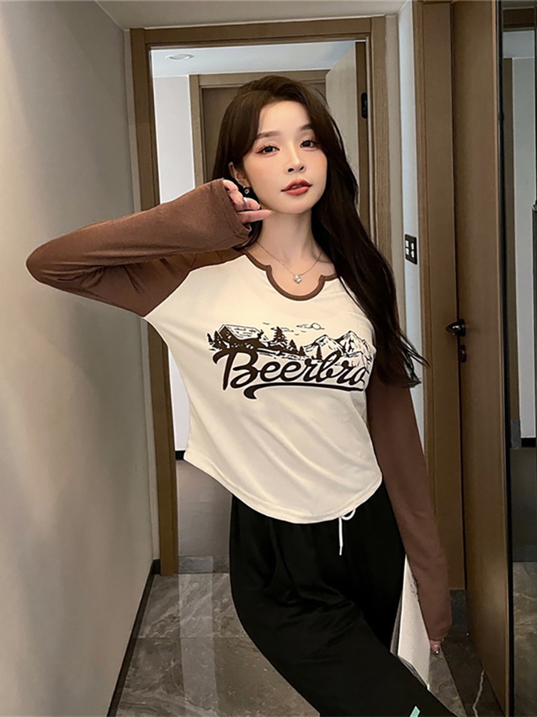 

StyleCast x Revolte Typography Printed Long Sleeve Regular Top, Brown