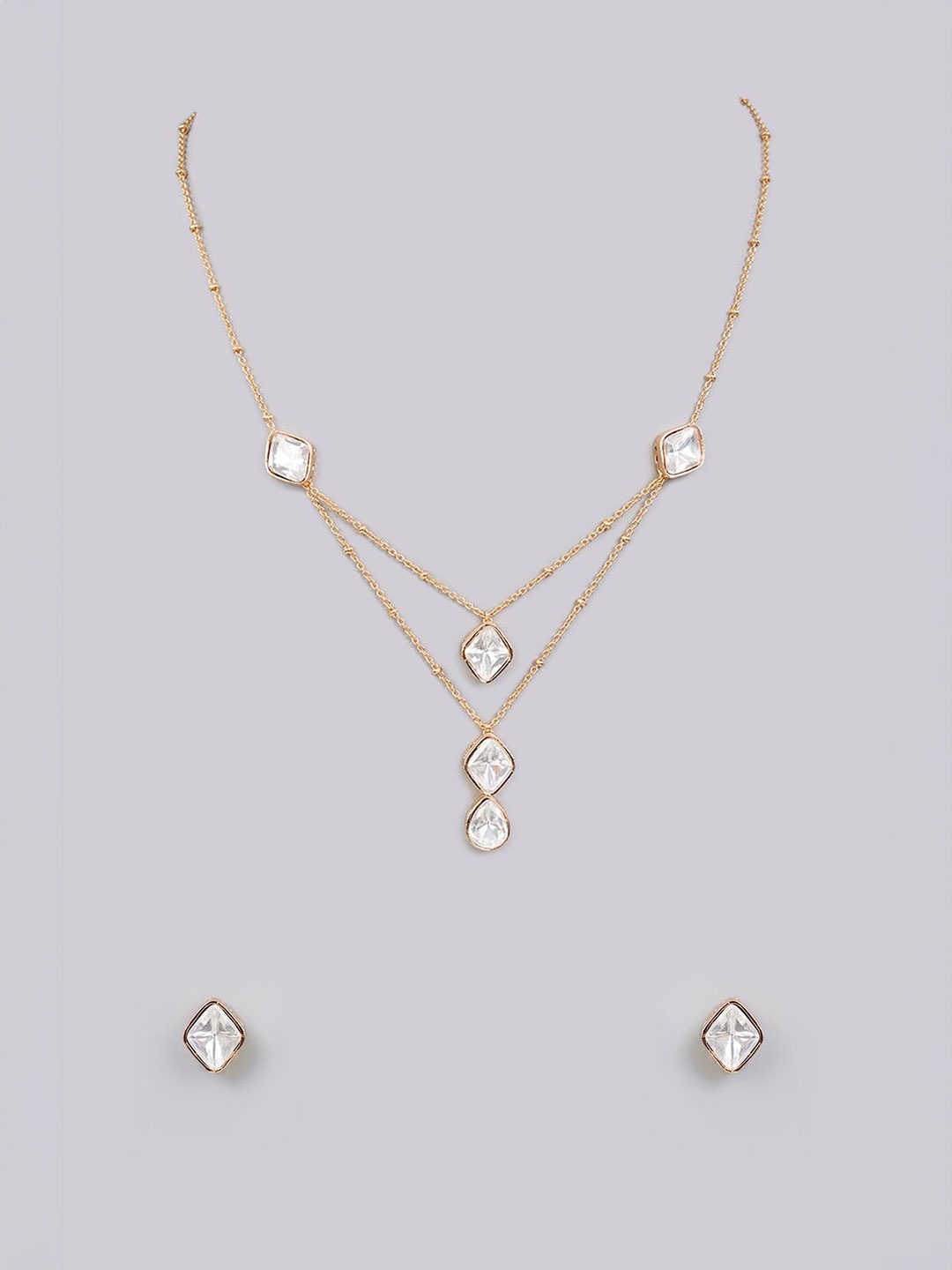 

AURAA TRENDS Gold-Plated Stone-Studded Jewellery Set