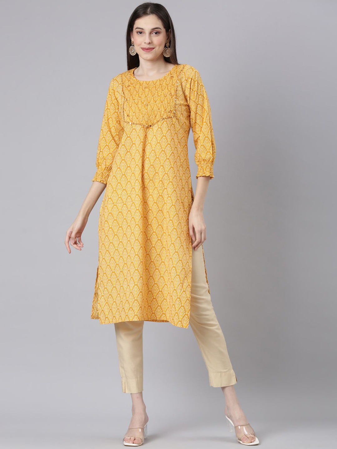 

Neerus Women Quirky Printed Mirror Work Kurta, Mustard