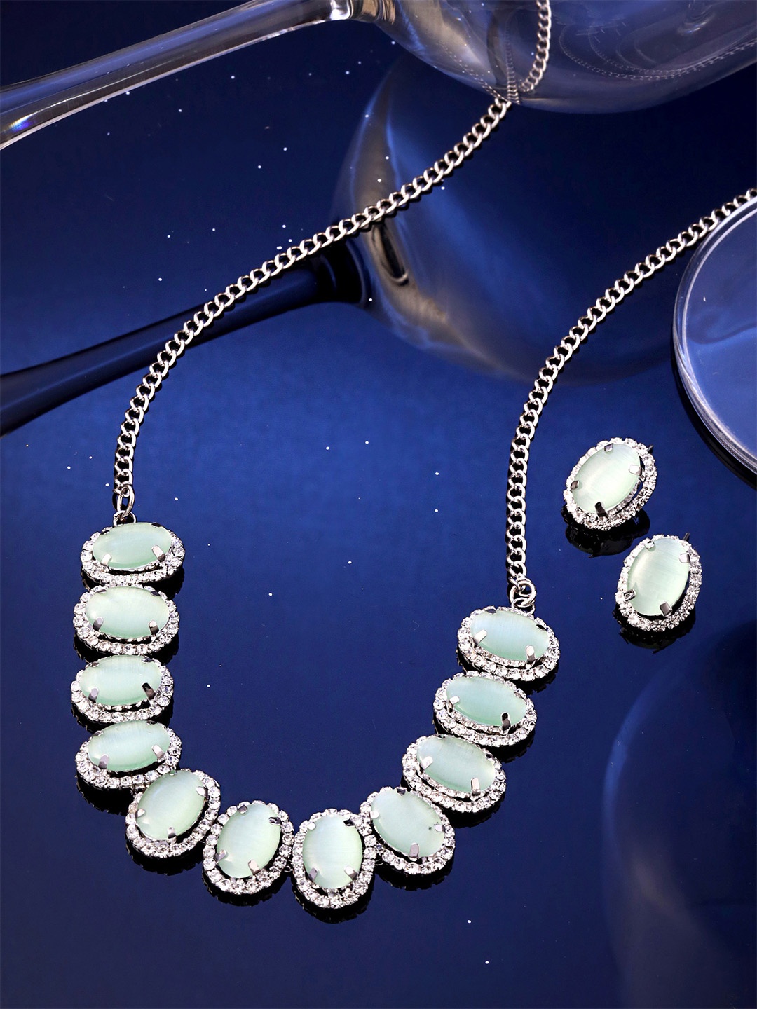 

Yellow Chimes Silver-Plated Crystal & Stone Studded Oval Design Jewellery Set