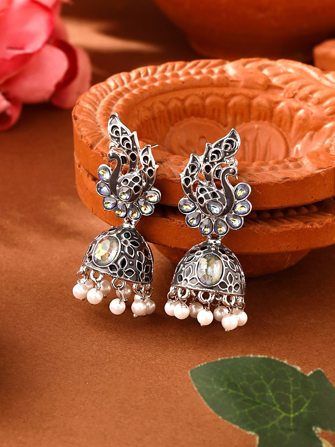 

Yellow Chimes Silver Oxidised Crystal Studded Jhumka Earrings, Grey