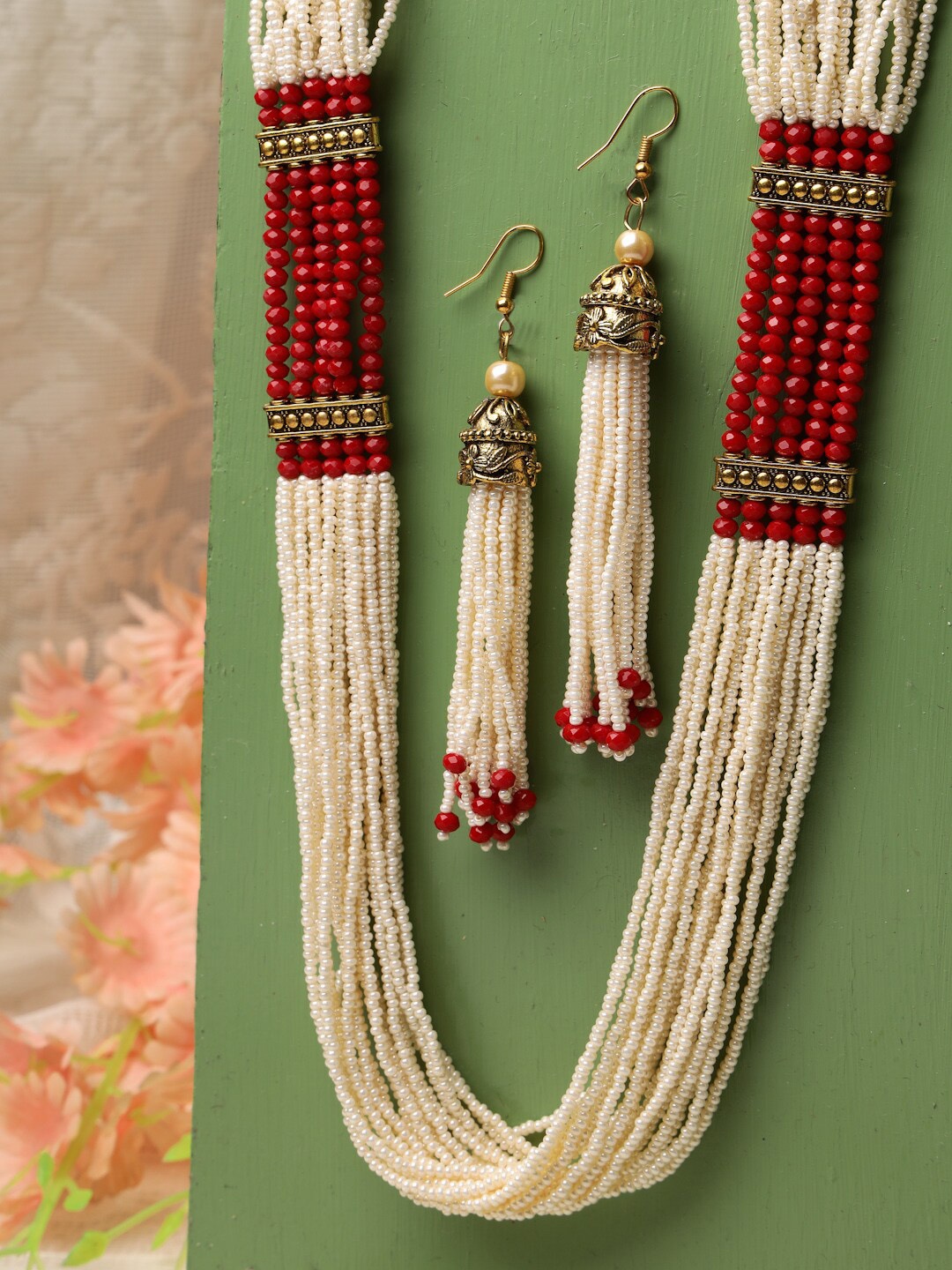 

Moedbuille Oxidised Gold-Plated Red & Off White Beads Studded Tasselled Jewellery Set