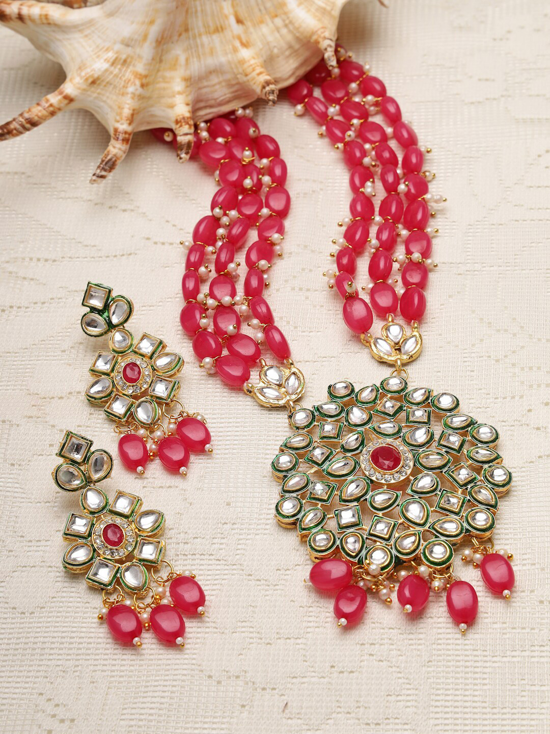 

Moedbuille Gold-Plated Pink & White Kundan Studded & Beaded Jewellery Set