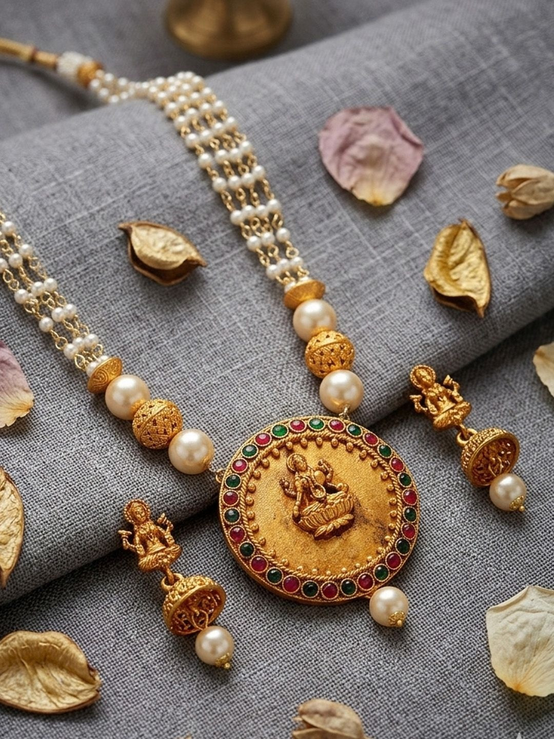 ANIKAS CREATION Women Gold-Plated Stone Studded & Pearl Temple Jewellery Set