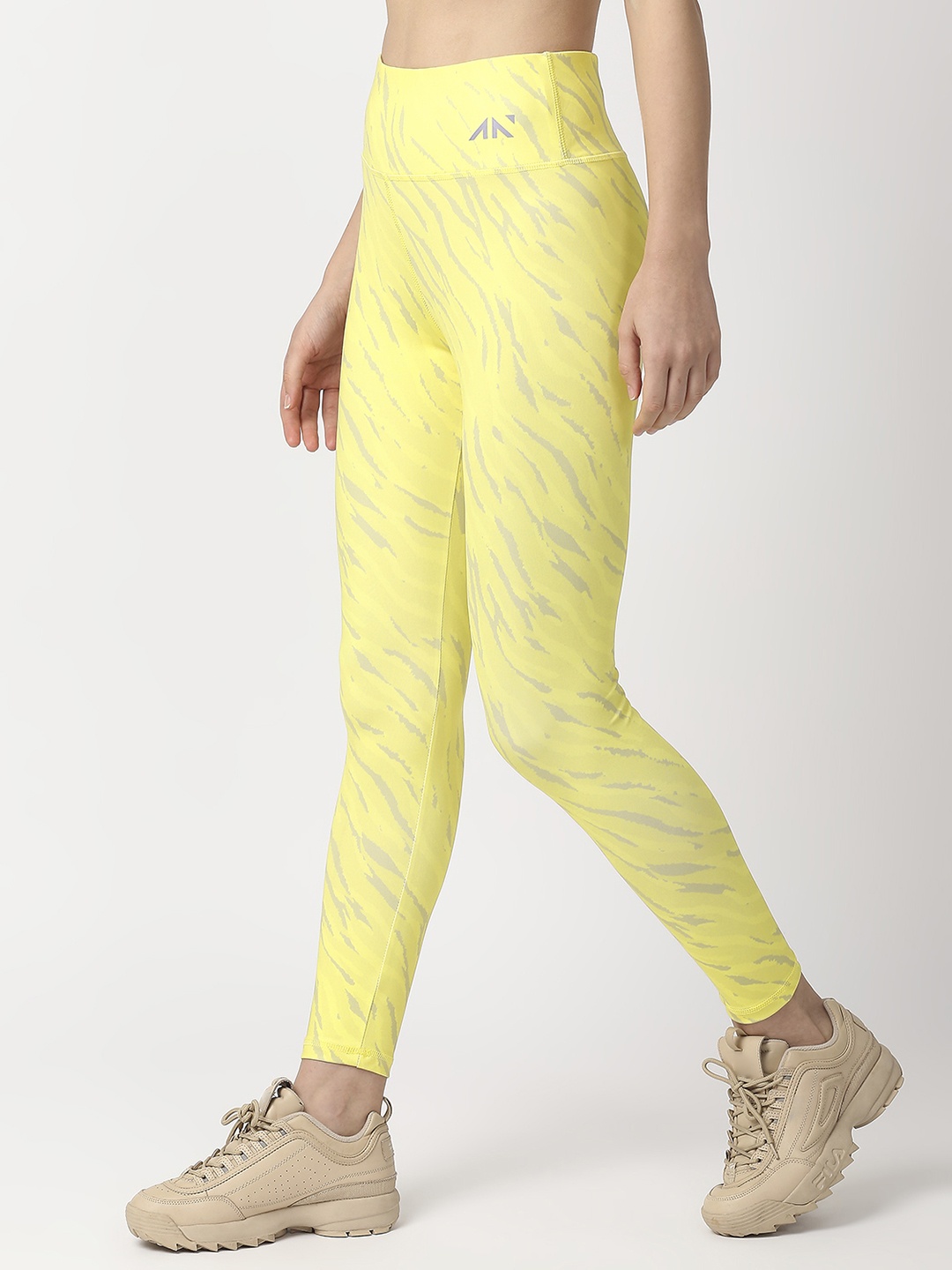 

AESTHETIC NATION Women Yellow Printed Dry Fit Tights