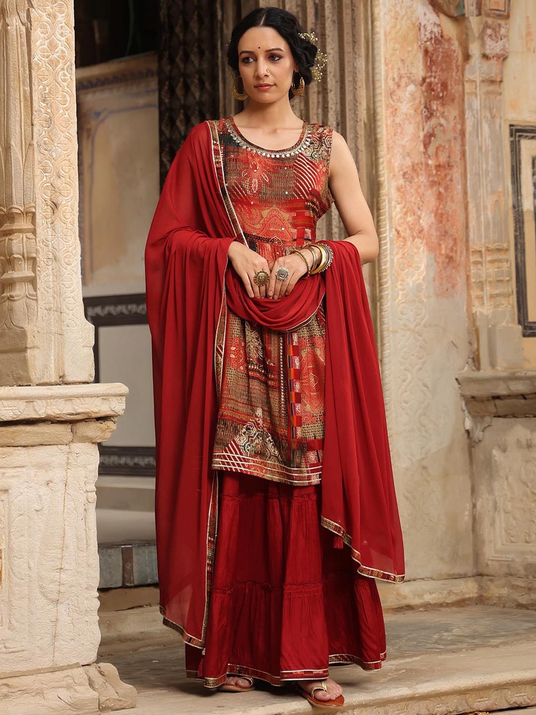 

SCAKHI Women Maroon Printed Pleated Mirror Work Kurta with Sharara & Dupatta