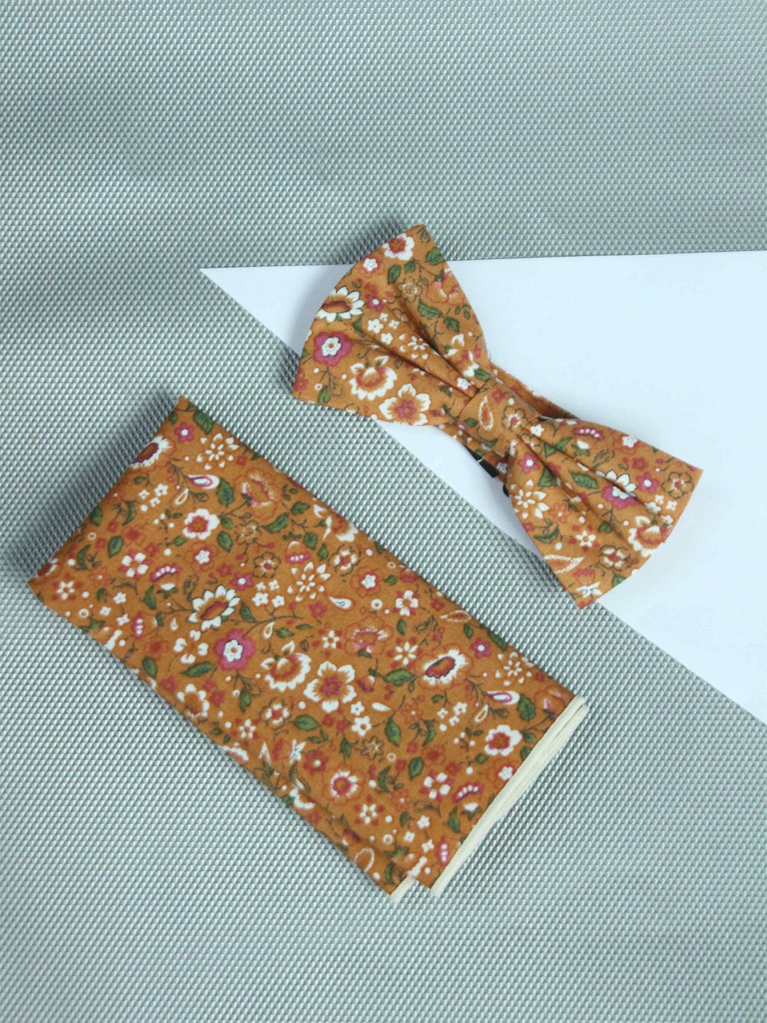 

Tossido Men Orange & White Printed Bow Tie & Pocket Square
