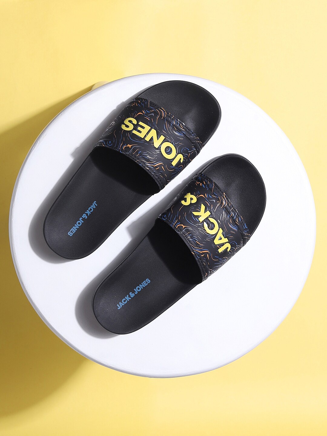 

Jack & Jones Men Black & Yellow Printed Synthetic Sliders