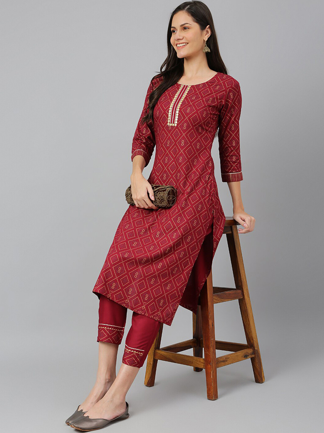 

Kiana Women Maroon Printed Kurta with Trousers