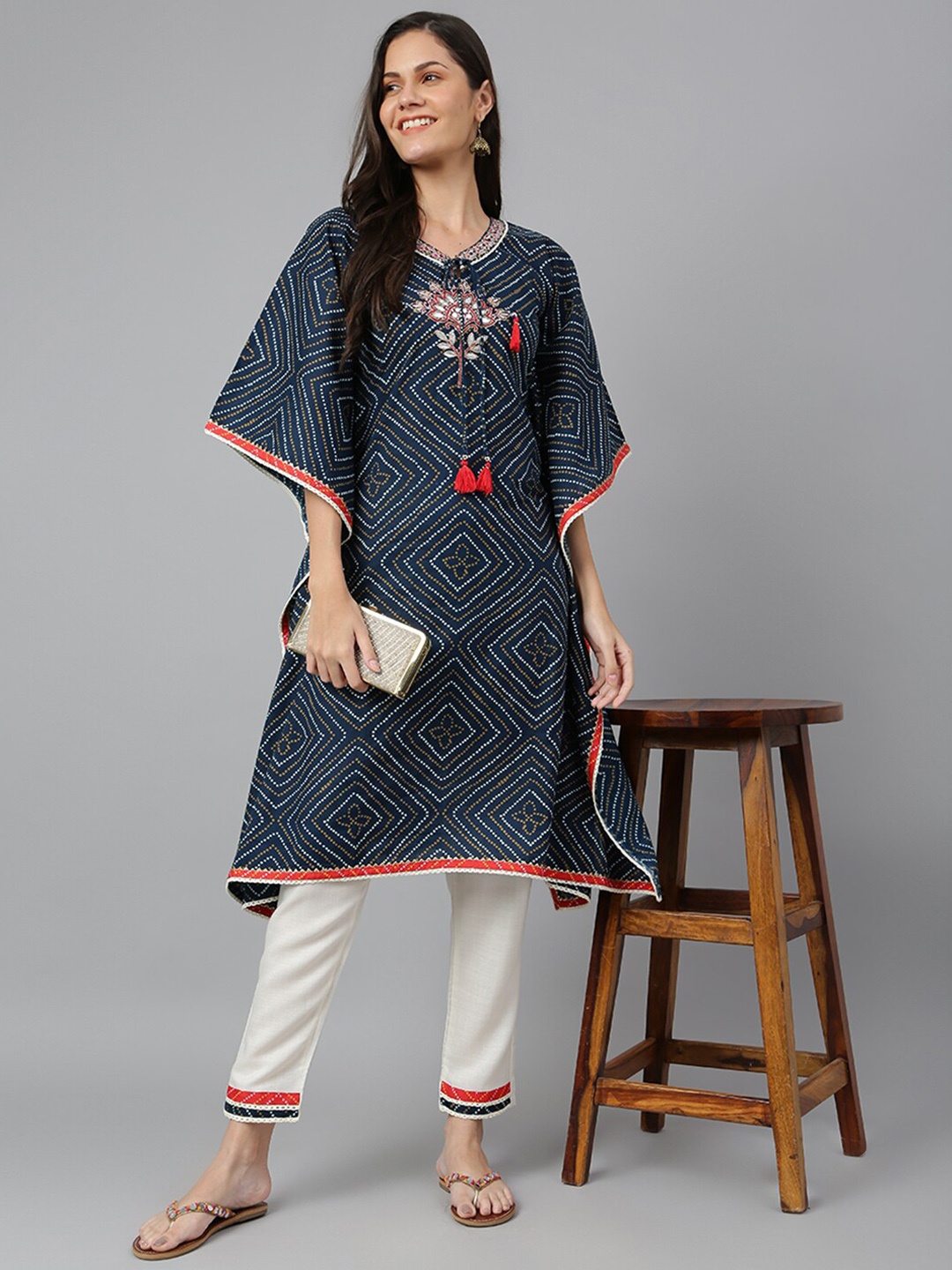 

Kiana Women Blue Ethnic Motifs Printed Kurta with Trousers