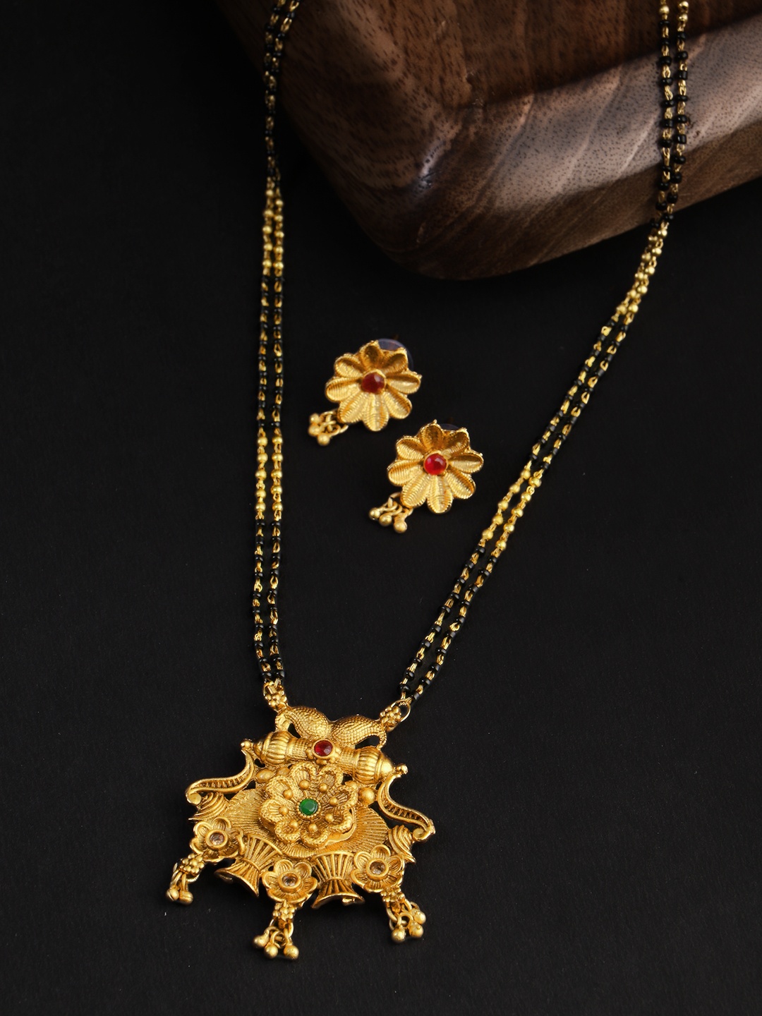 

Adwitiya Collection Gold-Plated Black & Red Stone-Studded & Beaded Mangalsutra With Earrings