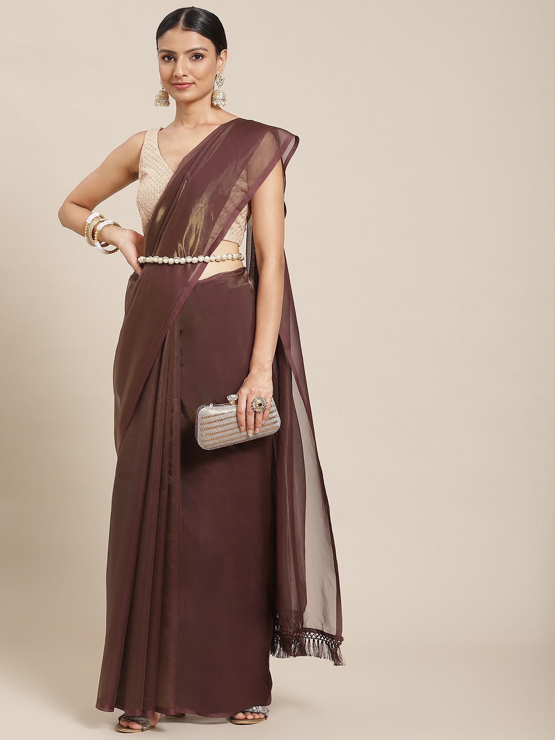 

Tikhi Imli Women Brown Solid Organza Saree