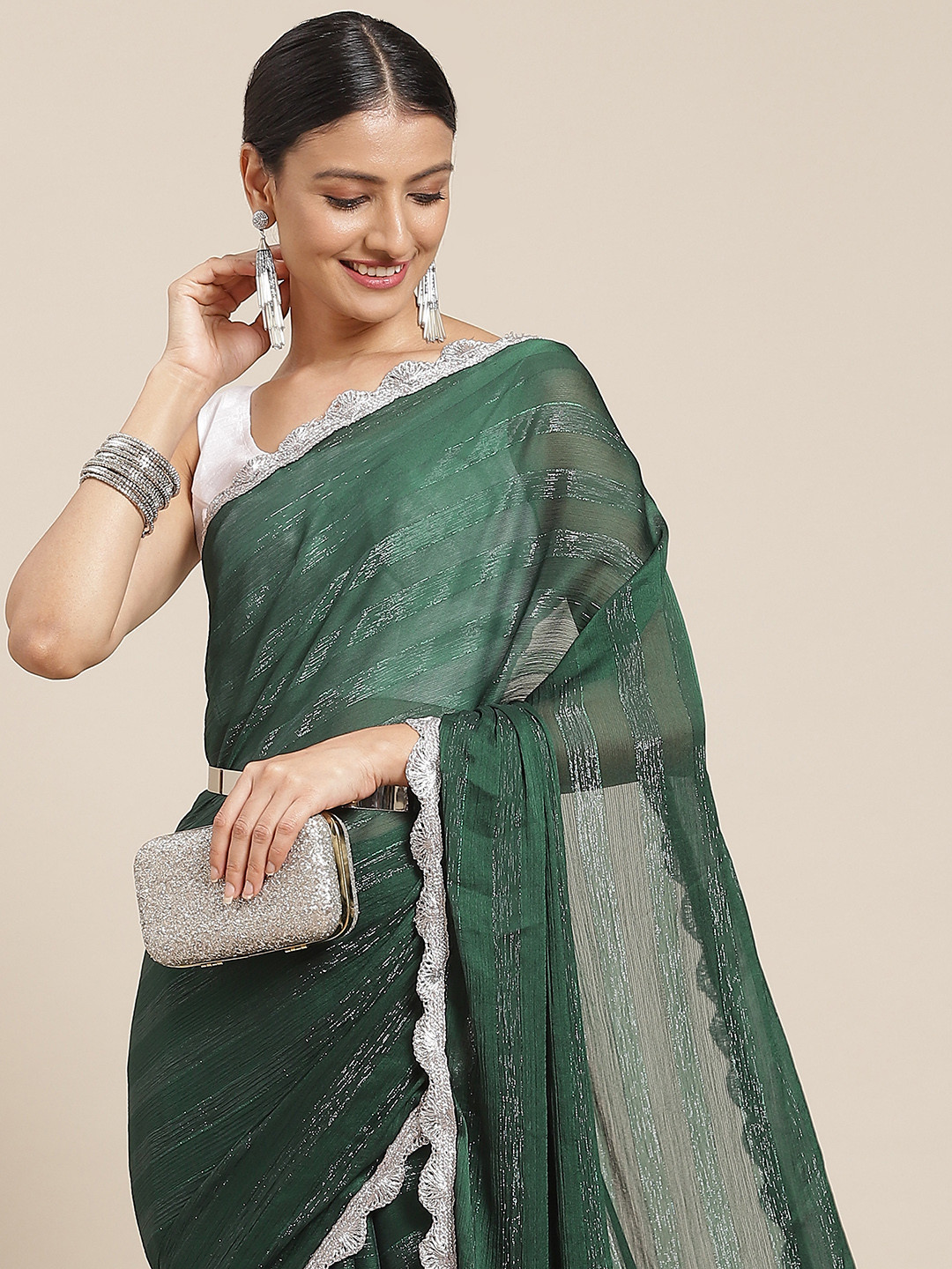

Tikhi Imli Green Embellished Striped Saree