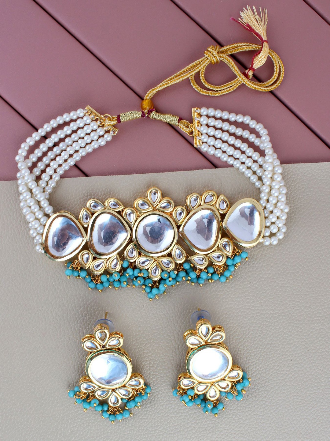 

LUCKY JEWELLERY Gold-Plated White Kundan-Studded & Turquoise Blue Beaded Jewellery Set