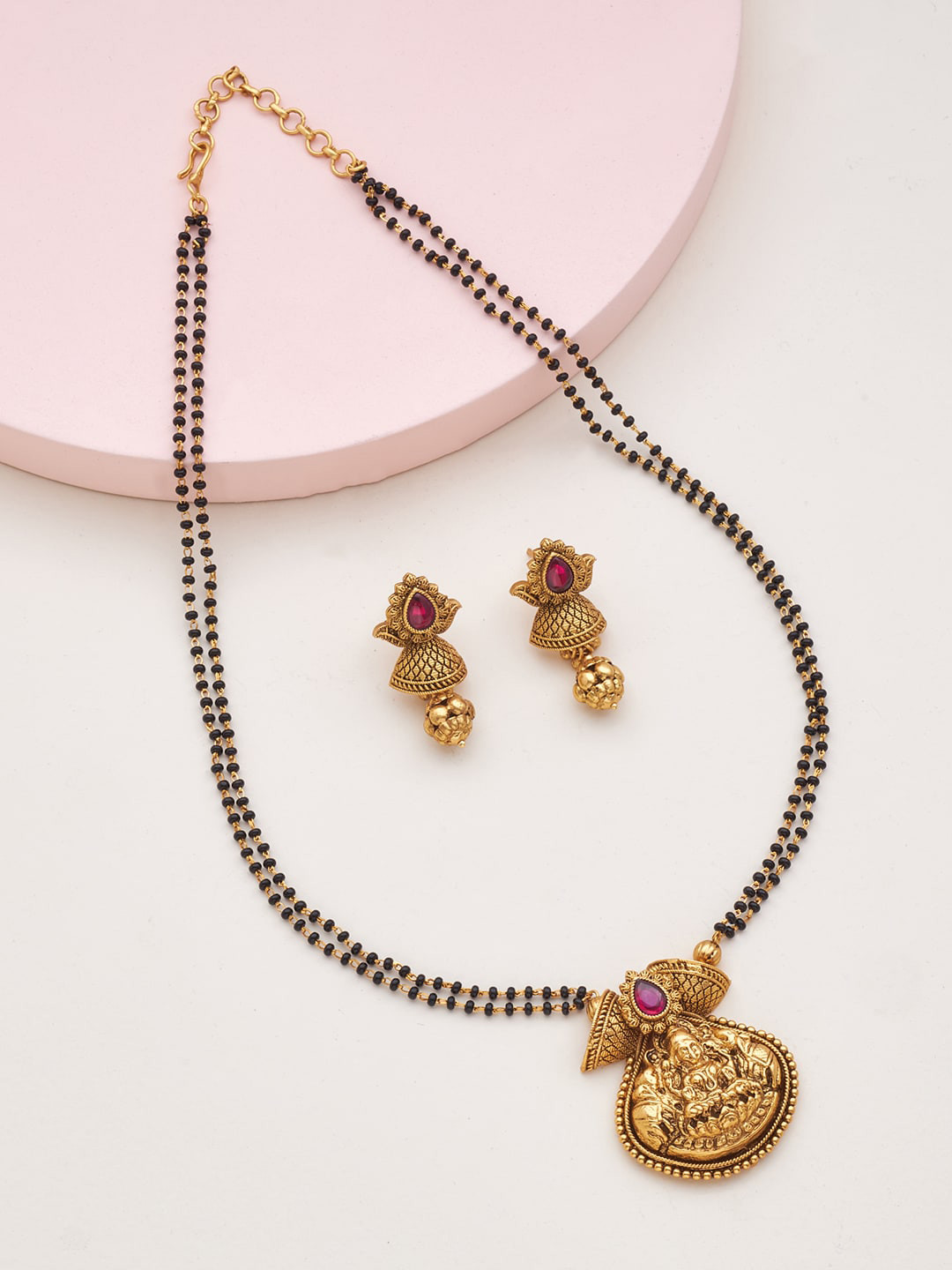 

Kushal's Fashion Jewellery Gold-Toned & Red Stone-Studded Black Beaded Mangalsutra