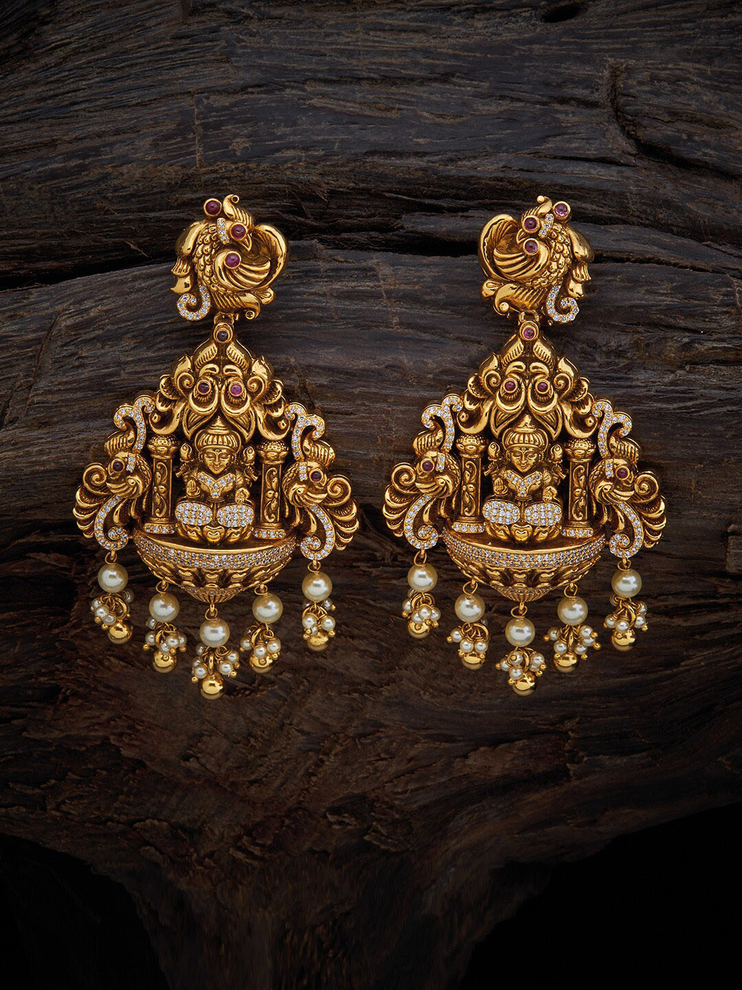 

Kushal's Fashion Jewellery Women Gold-Toned & White Contemporary Temple Drop Earrings