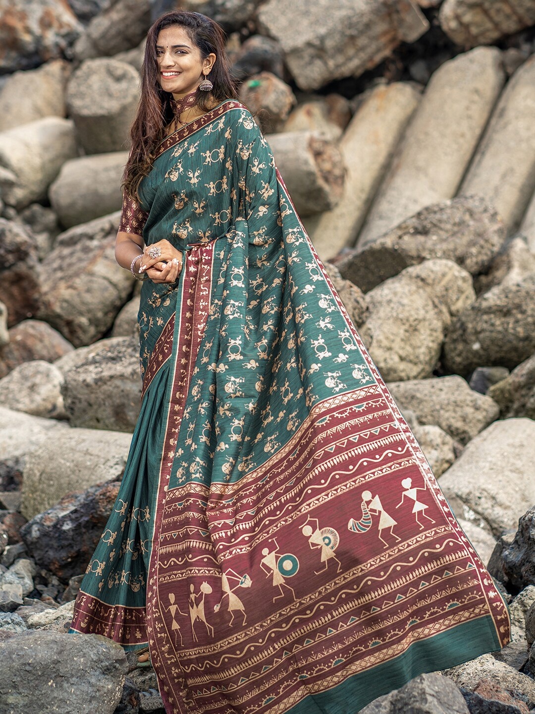 

Mitera Teal & Maroon Warli Silk Blend Dabu Saree
