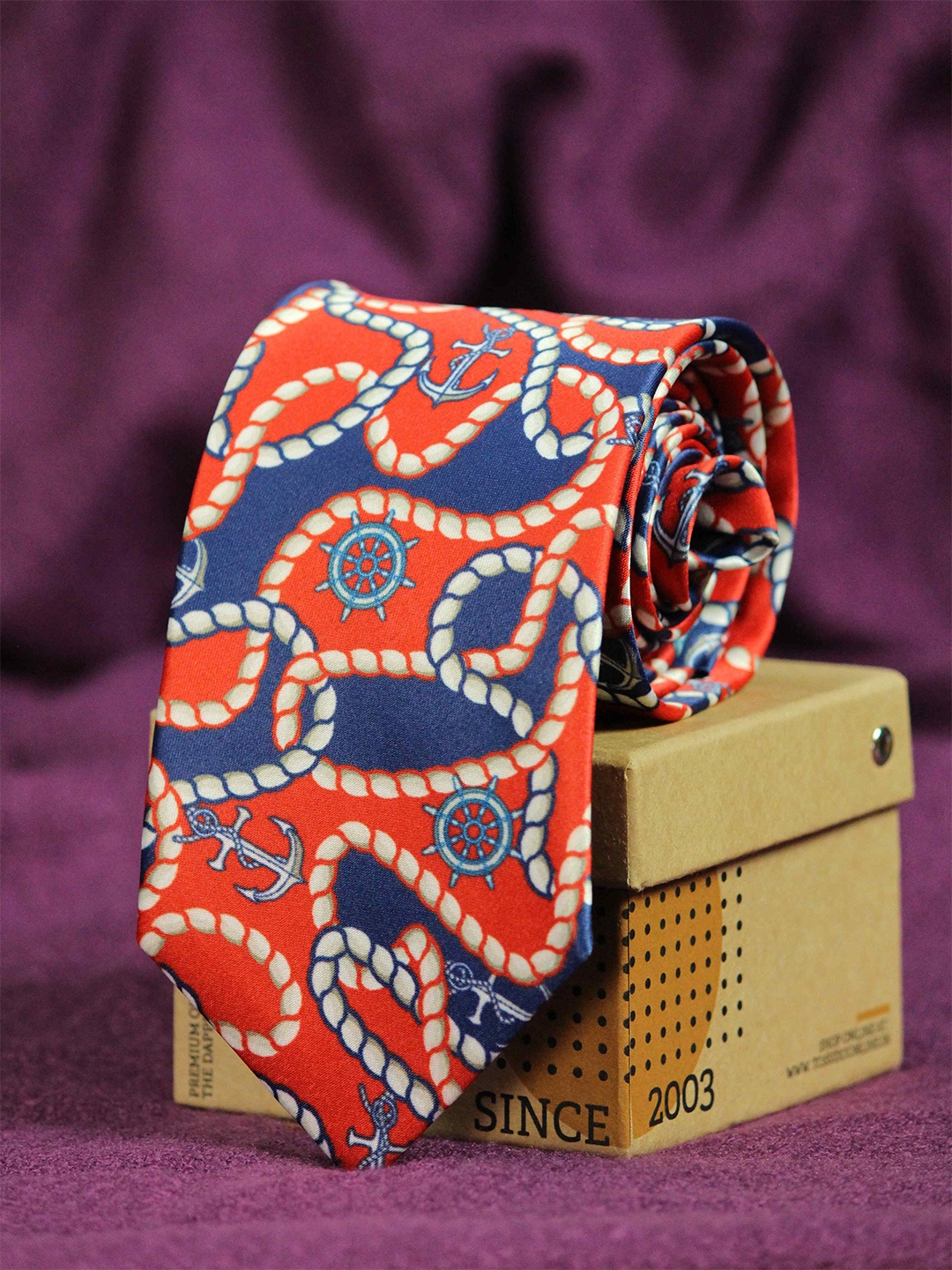 

Tossido Men Red & Blue Printed Broad Tie