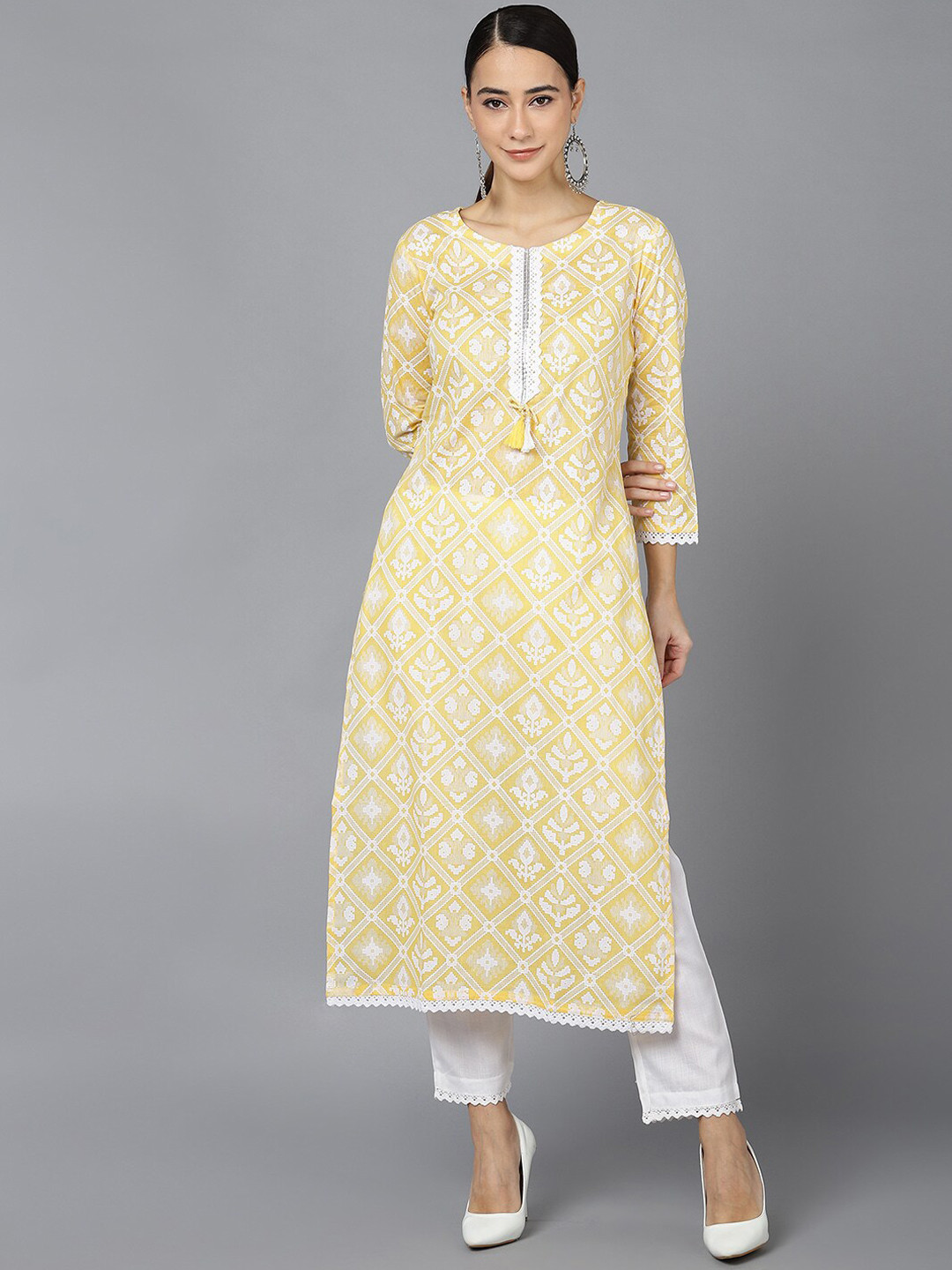 

AHIKA Women Yellow Ethnic Motifs Printed Thread Work Kurta