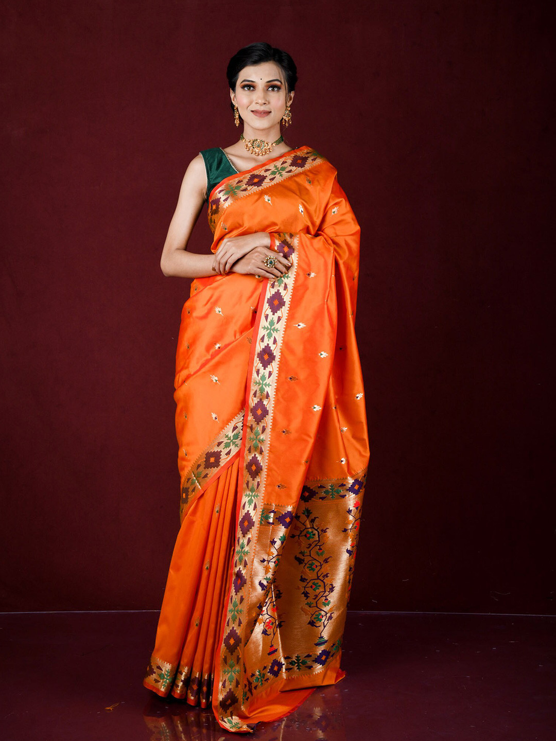 

Exclusiva Orange & Green Ethnic Motifs Zari Silk Blend Banarasi Saree