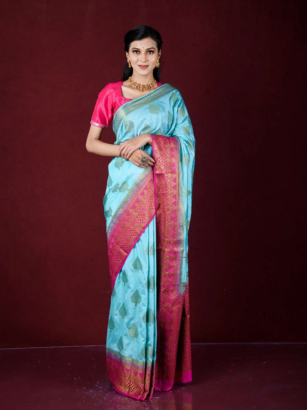 

Exclusiva Turquoise Blue & Pink Ethnic Motifs Zari Silk Blend Banarasi Saree