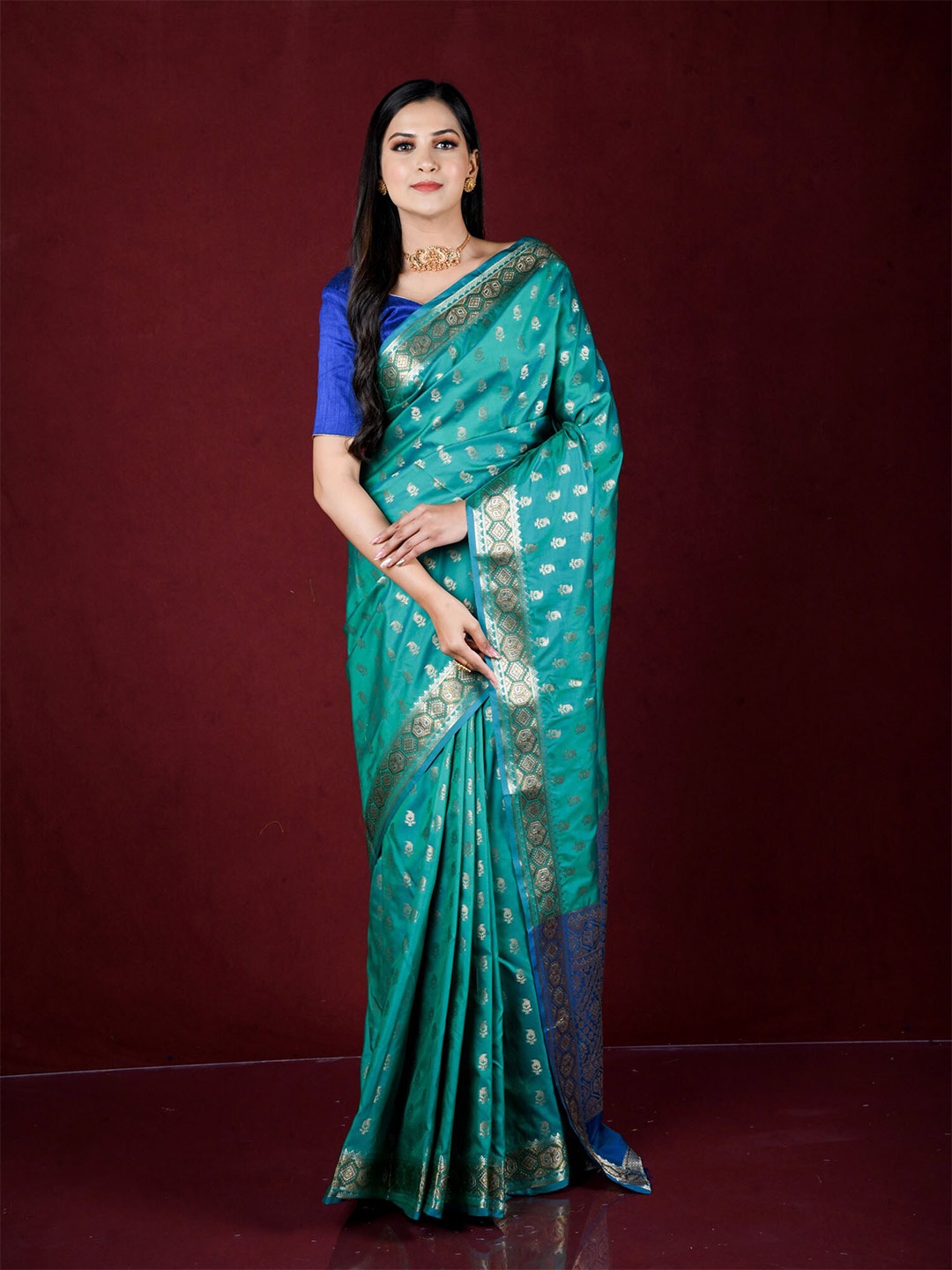 

Exclusiva Green & Blue Ethnic Motifs Zari Silk Blend Banarasi Saree