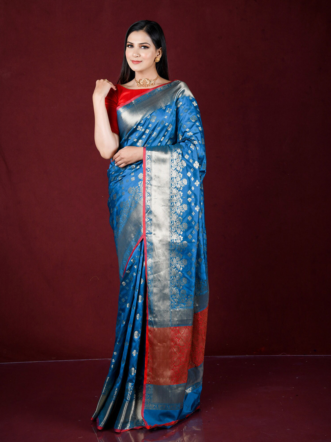 

Exclusiva Blue & Red Woven Design Zari Silk Blend Banarasi Saree