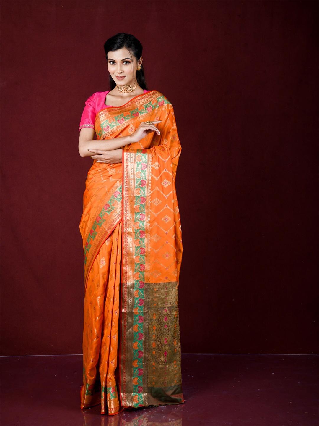 

Exclusiva Orange & Gold-Toned Ethnic Motifs Zari Silk Blend Banarasi Saree