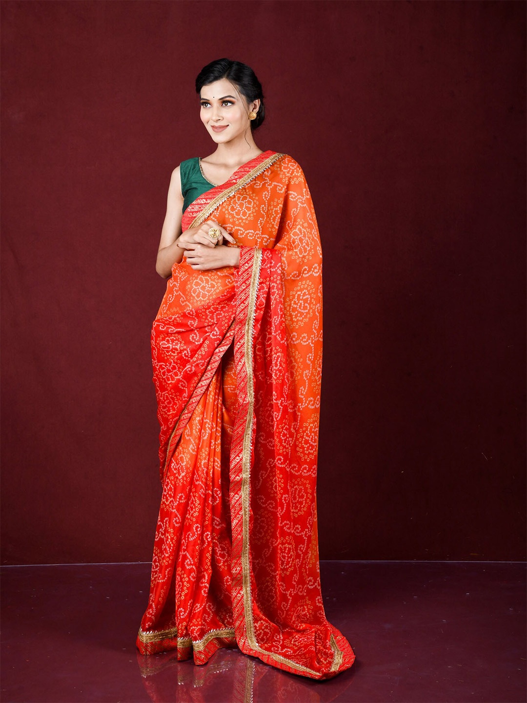 

Exclusiva Orange & Off White Bandhani Embroidered Saree