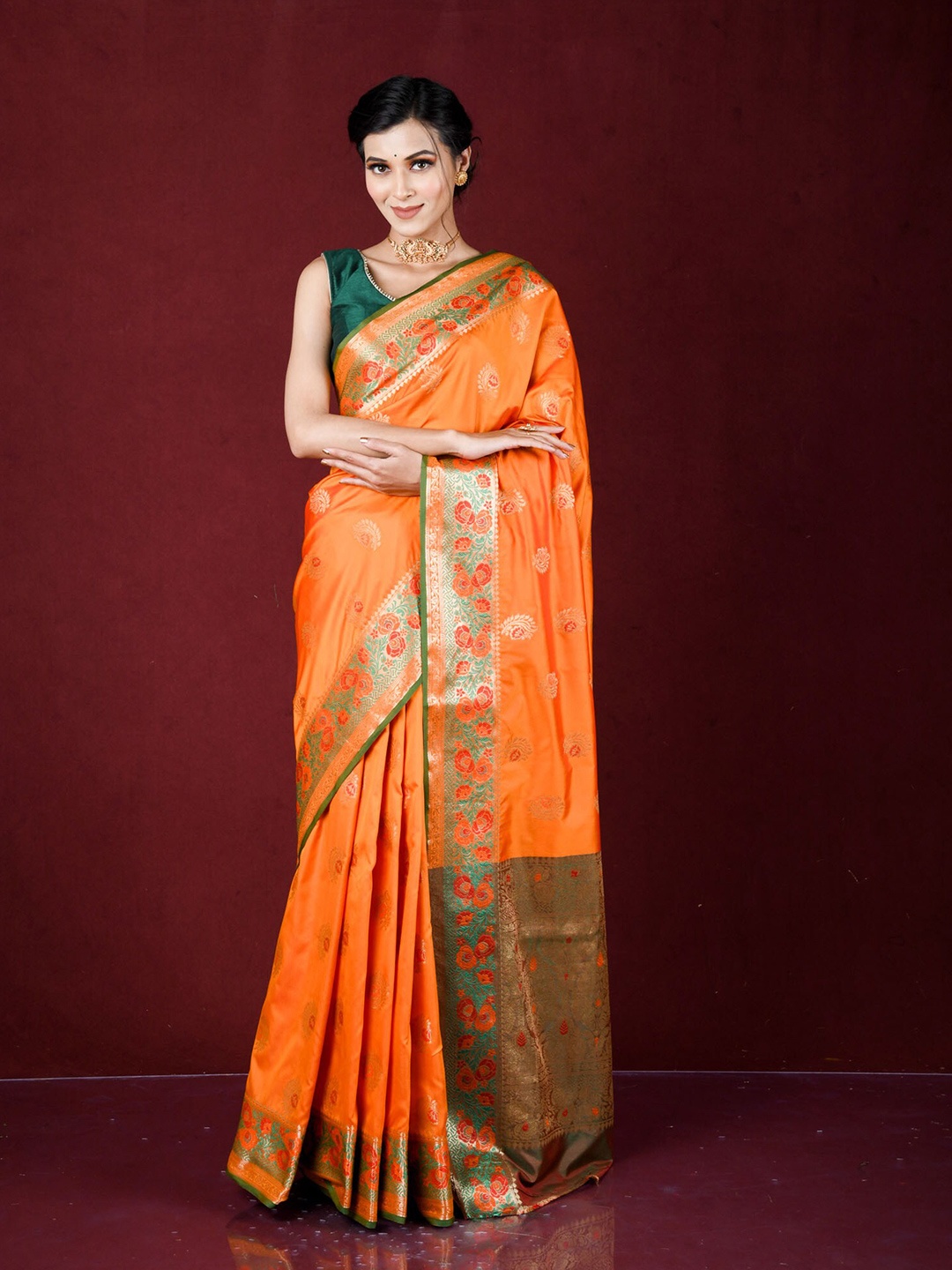 

Exclusiva Orange & Green Ethnic Motifs Zari Silk Blend Banarasi Saree