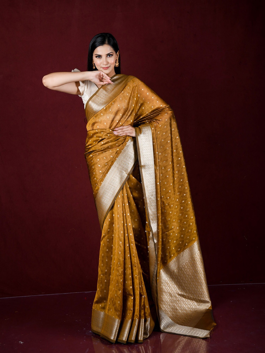 

Exclusiva Mustard & Silver-Toned Ethnic Motifs Zari Organza Banarasi Saree