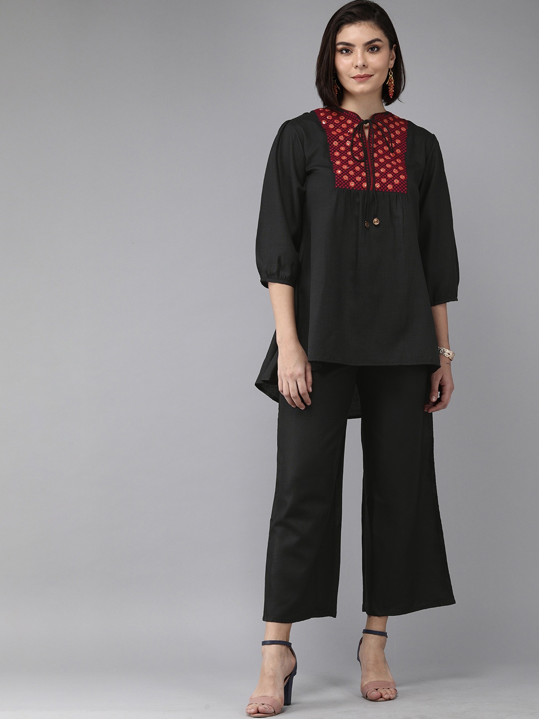 

Bhama Couture Women Black Embroidered Mirror Work Kurti with Palazzos